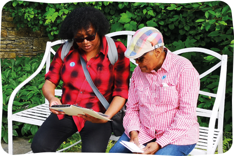 woman and mum sitting on bench in the park