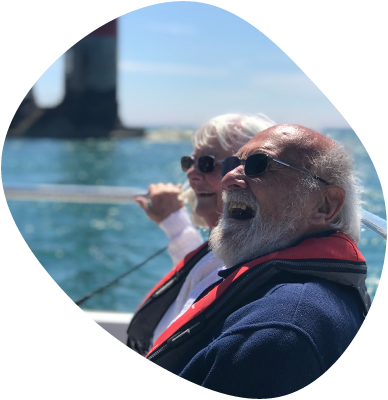 man and woman laughing on a boat