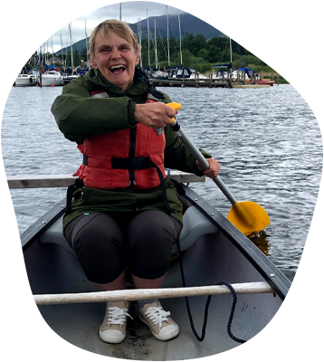 Lady laughing in a canoe in the Lake District