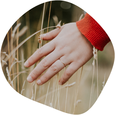 Hand going through tall grass