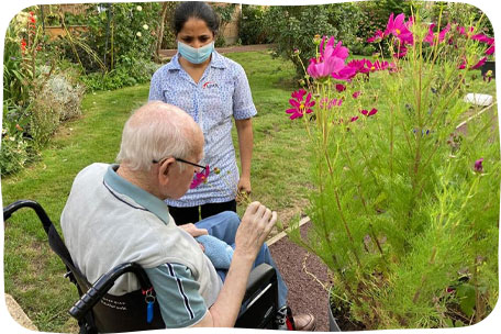 Smelling flowers in the garden