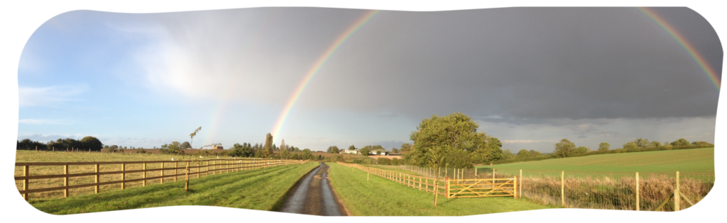 Pathway to the Dementia Adventure office, with a rainbow over it.