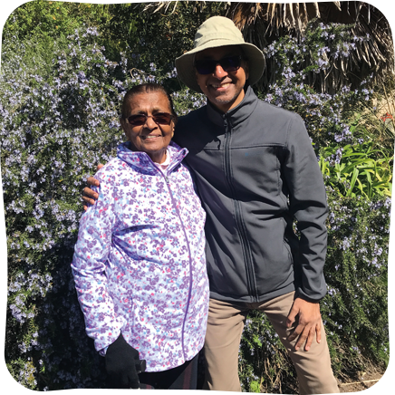 Dhankuvar and Hitesh in gardens on a sunny day