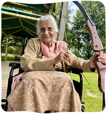 Lady in a wheelchair taking part in archery