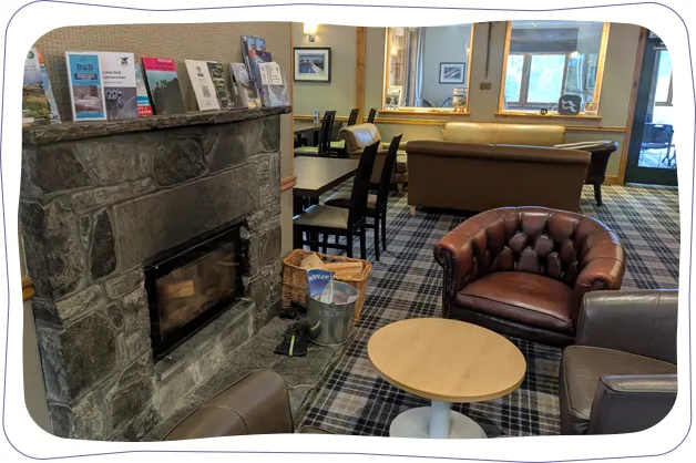 Glenmore Lodge - fireplace in eating area